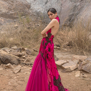 profile shot of Women's hot pink sculpted gown with black applique and sheer open back – bold red carpet couture look