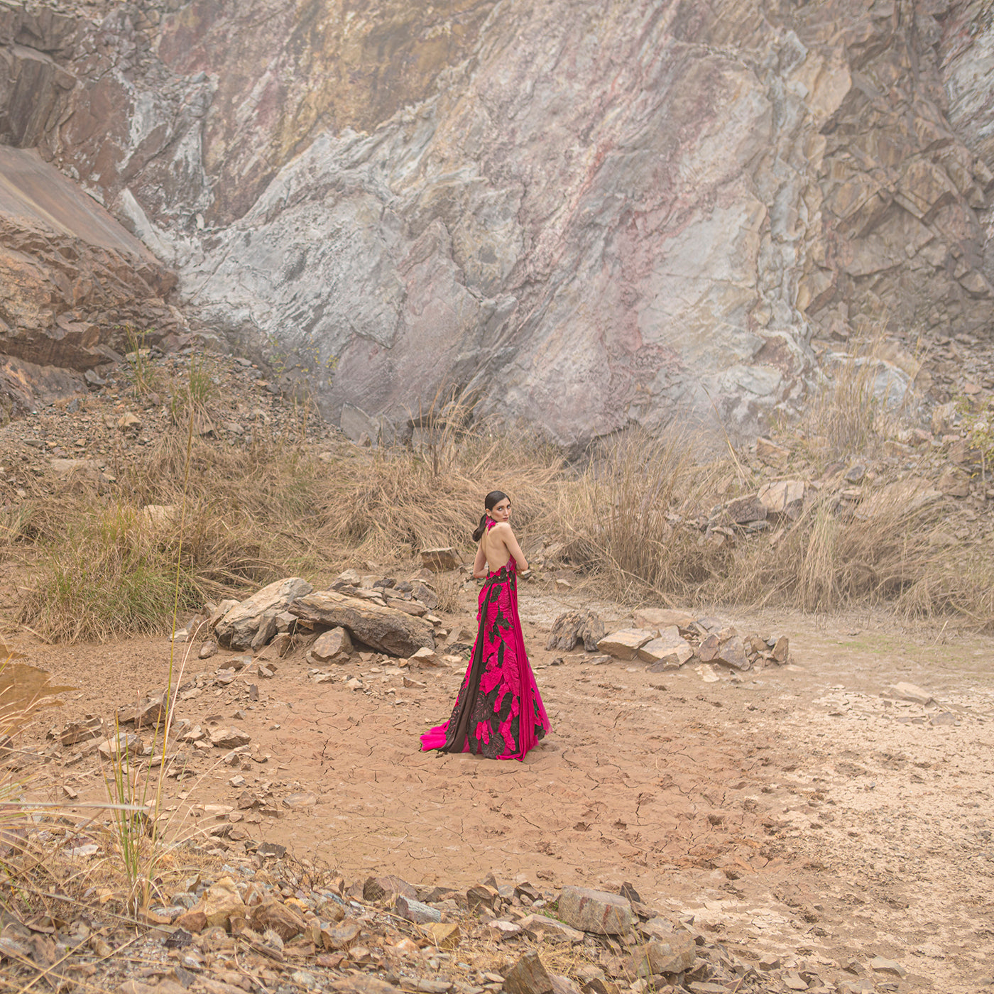 wide shot of Women's backless gown with sculptural applique – dramatic designer dress for red carpet events