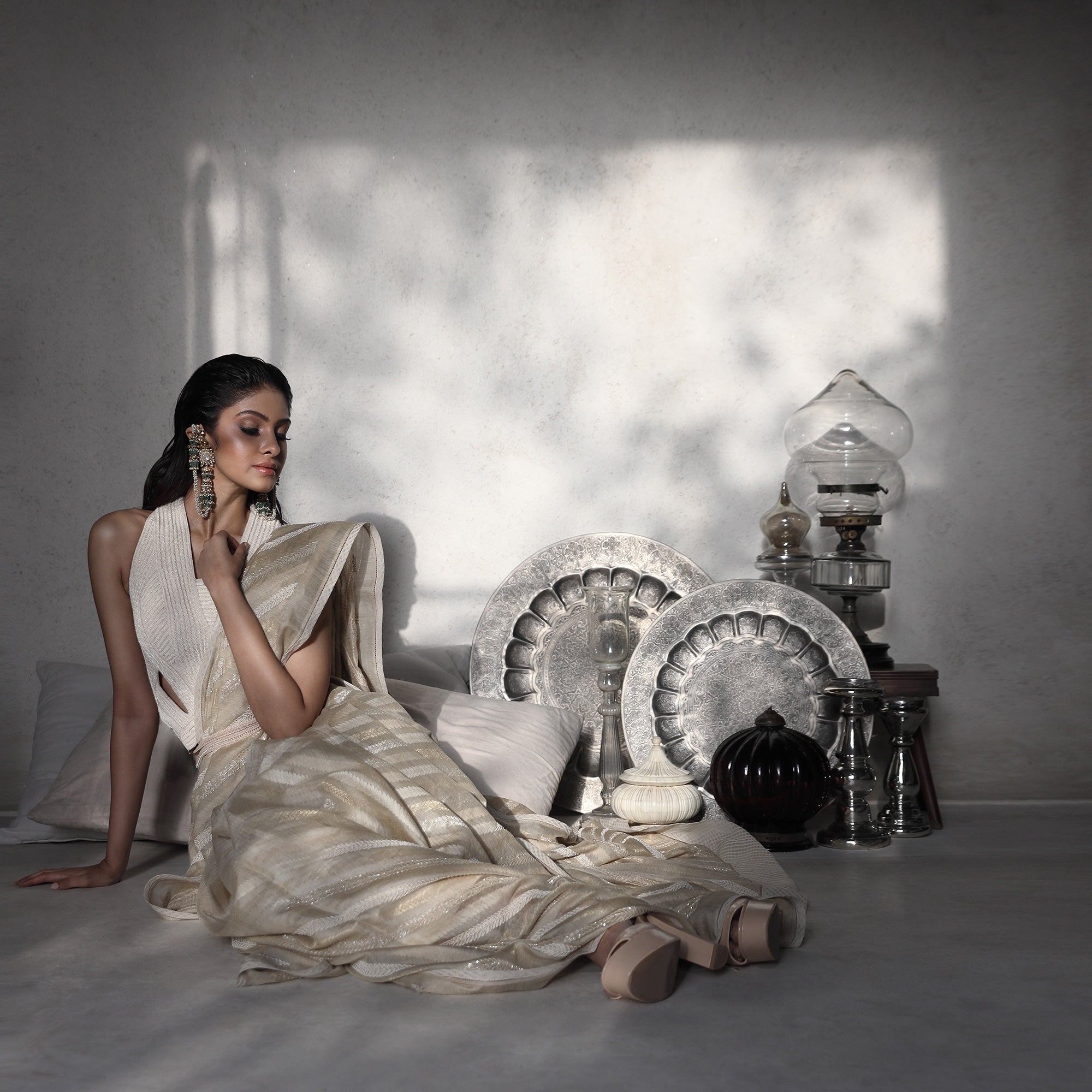 Women's ivory tusser silk saree with metallic thread embroidery paired with pearl-collared blouse – modern ethnic fusion for reception styling