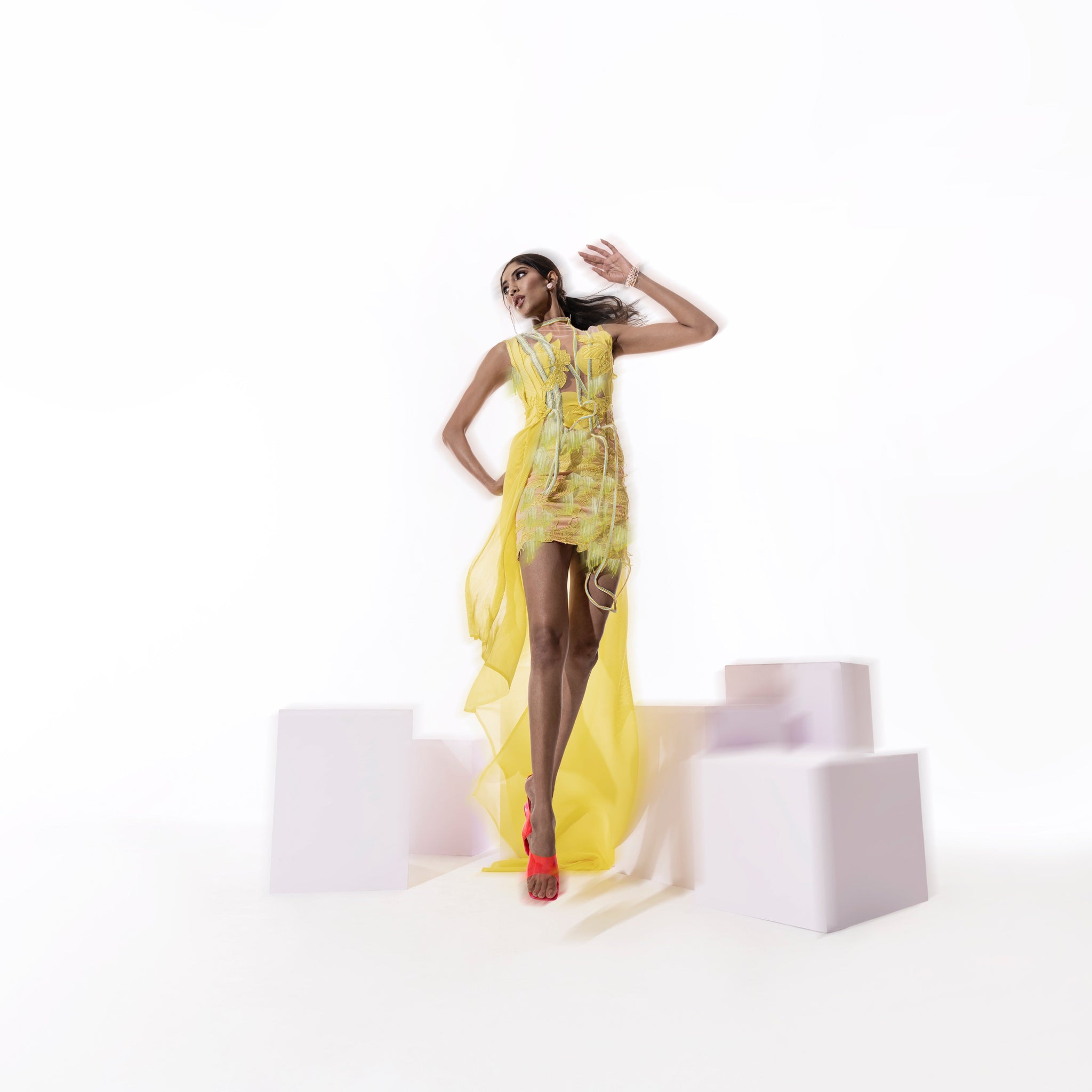 Women's yellow V-neck mini dress with layered trail and 3D applique – fluid couture for statement moment