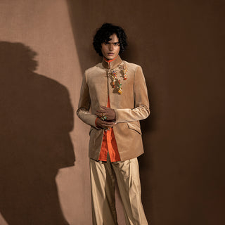 front view of Men's velvet Bandhgala with jewel embellishment and mandarin collar – structured festive jacket paired with wide-leg trousers for reception or occasion wear