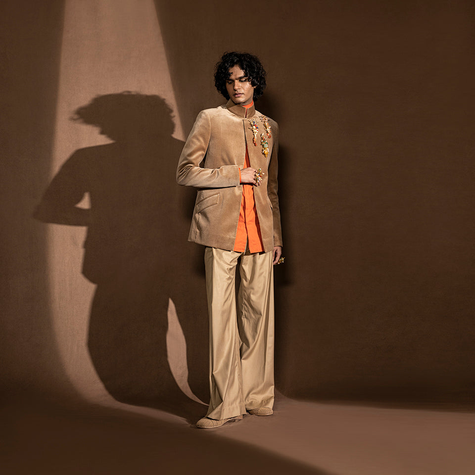 Men's velvet Bandhgala with gold embellishment and flared hem trousers – refined festive menswear with mandarin collar and silk base, ideal for reception or occasion wear